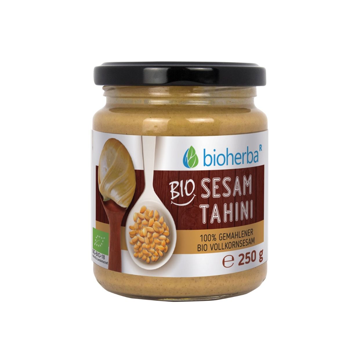 Glas Bio Sesam Tahini mit schwarzem Deckel. Etikett mit Logo, Text und Abbildung von Sesamkörnern auf einem Löffel.