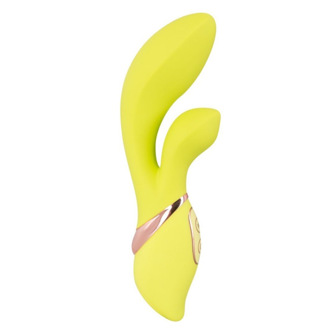 Gelber Vibrator mit zwei Köpfen und rosegoldenen Akzenten. Anatomisch geformt.