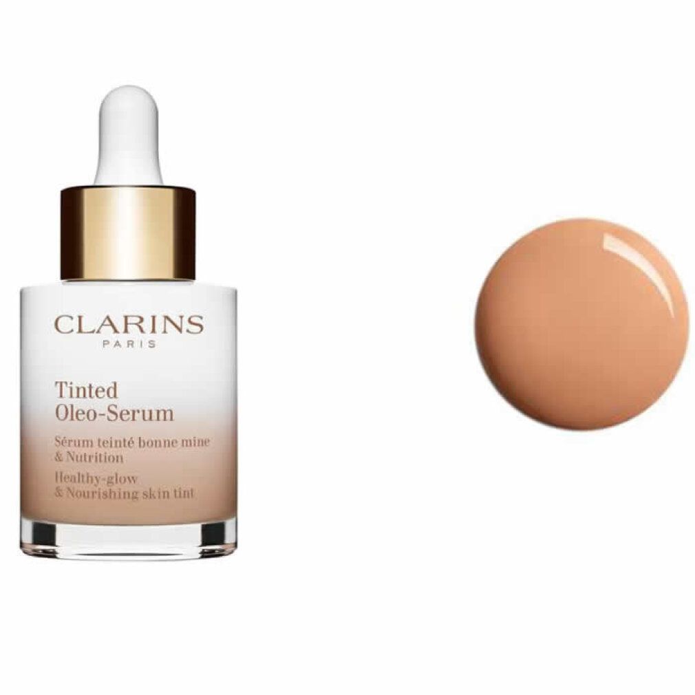Flakon mit Pipette und Produktklecks. Aufschrift: Clarins Paris, Tinted Oleo-Serum. Text: Sérum teinté bonne mine & Nutrition, Healthy-glow & Nourishing skin tint.