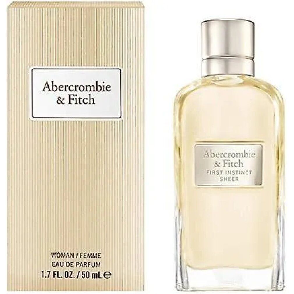Parfümflakon und Verpackung. Flakon mit Produktnamen. Verpackung mit Produktnamen und Text: WOMAN/FEMME, 1.7 FL. OZ. / 50 ml e.