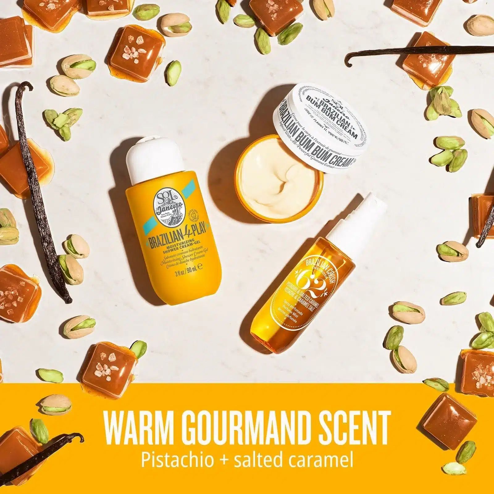 Gelbe Kosmetikprodukte auf weißem Untergrund. Enthält Creme, Spray und Duschgel. Aufschrift: Brazilian Bum Bum Cream.
