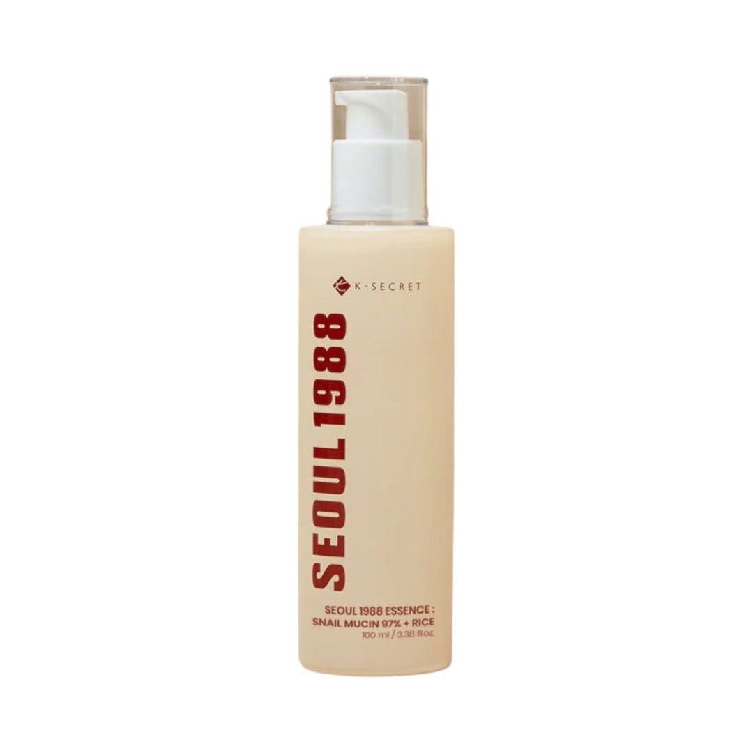 K-SECRET Seoul 1988 Essence Flakon mit Pumpspender. Beige Flasche mit rotem Schriftzug.