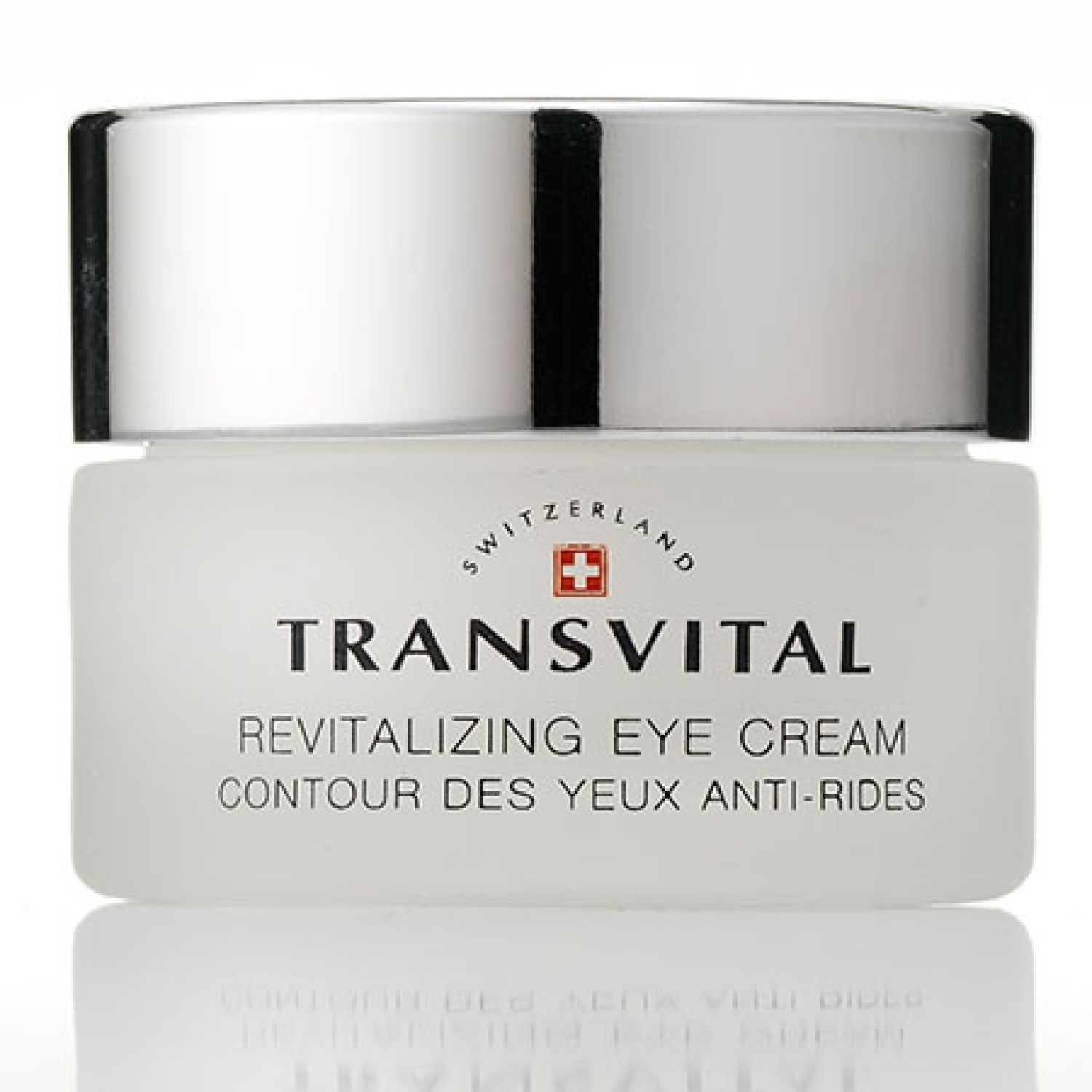 Cremebehälter mit silbernem Deckel. Aufschrift: TRANSVITAL, Revitalizing Eye Cream, Contour des yeux anti-rides. Schweizer Kreuz.