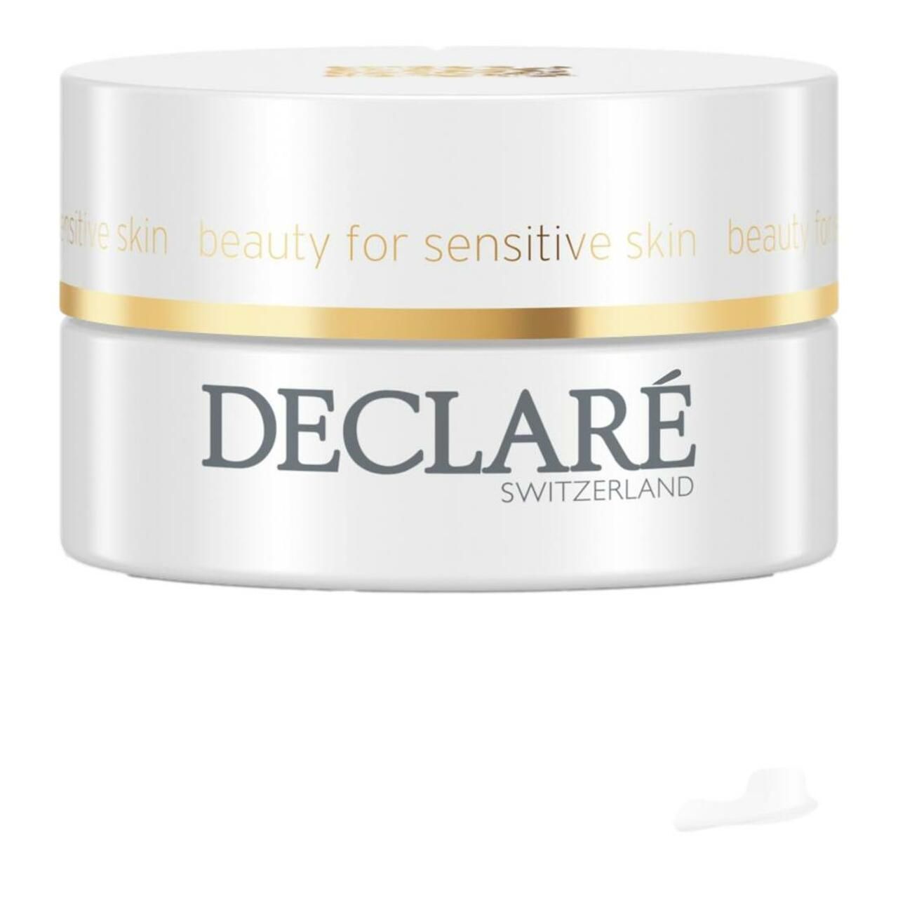 Weißer Tiegel mit goldenem Deckel und Schriftzug DECLARÉ SWITZERLAND. Aufschrift: beauty for sensitive skin. Klecks Creme.