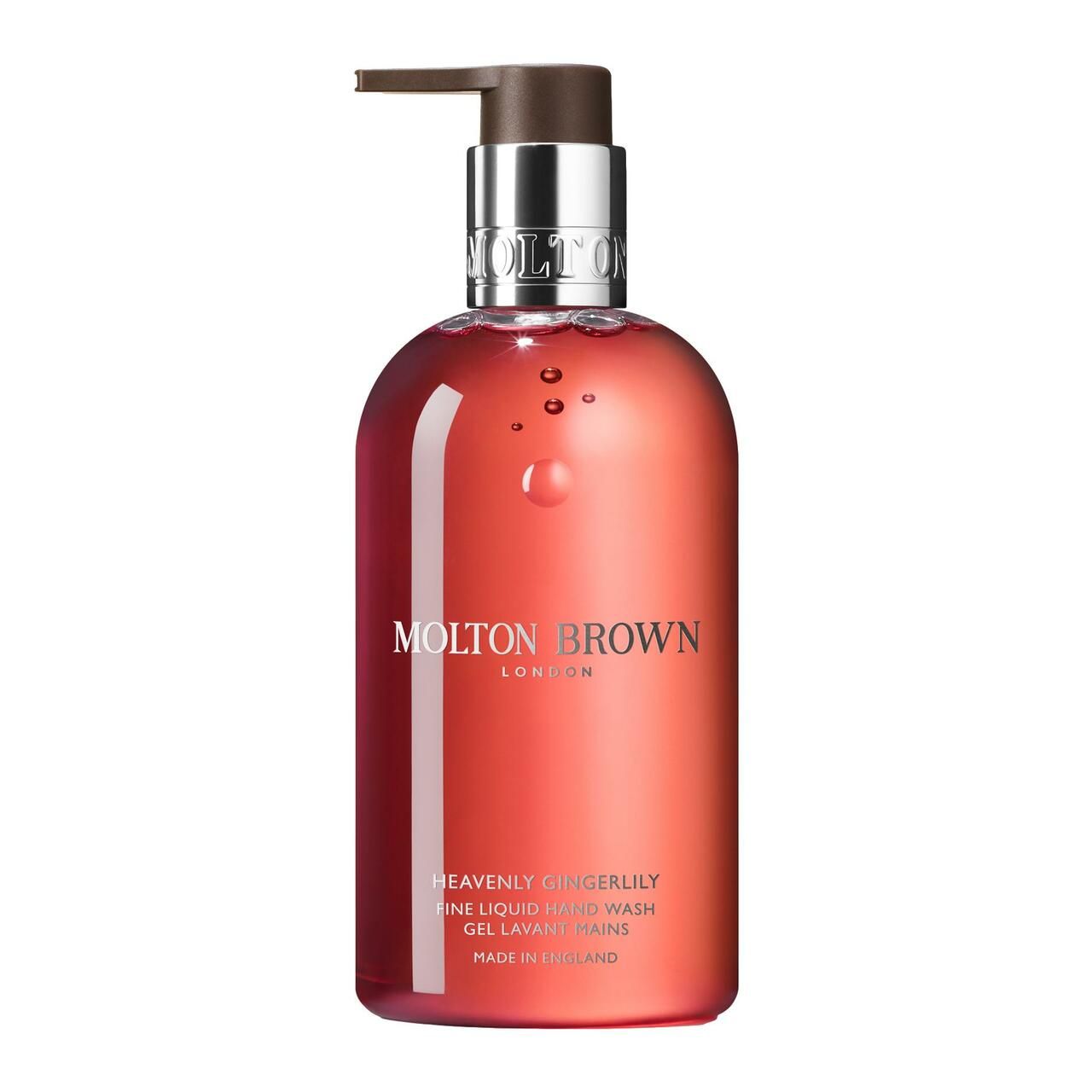 Runde, transparente Flasche mit Pumpe. Aufschrift: Molton Brown, Heavenly Gingerlily, Fine Liquid Hand Wash. Made in England.