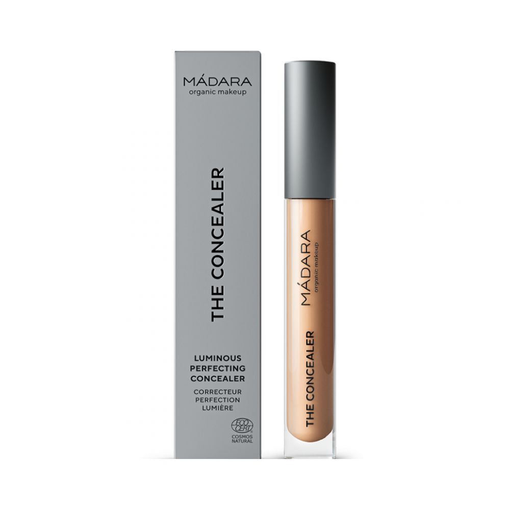 Concealer und Verpackung. Aufschrift: MÁDARA, THE CONCEALER, Luminous Perfecting Concealer, Corrector Perfection Lumière. Cosmos Natural.