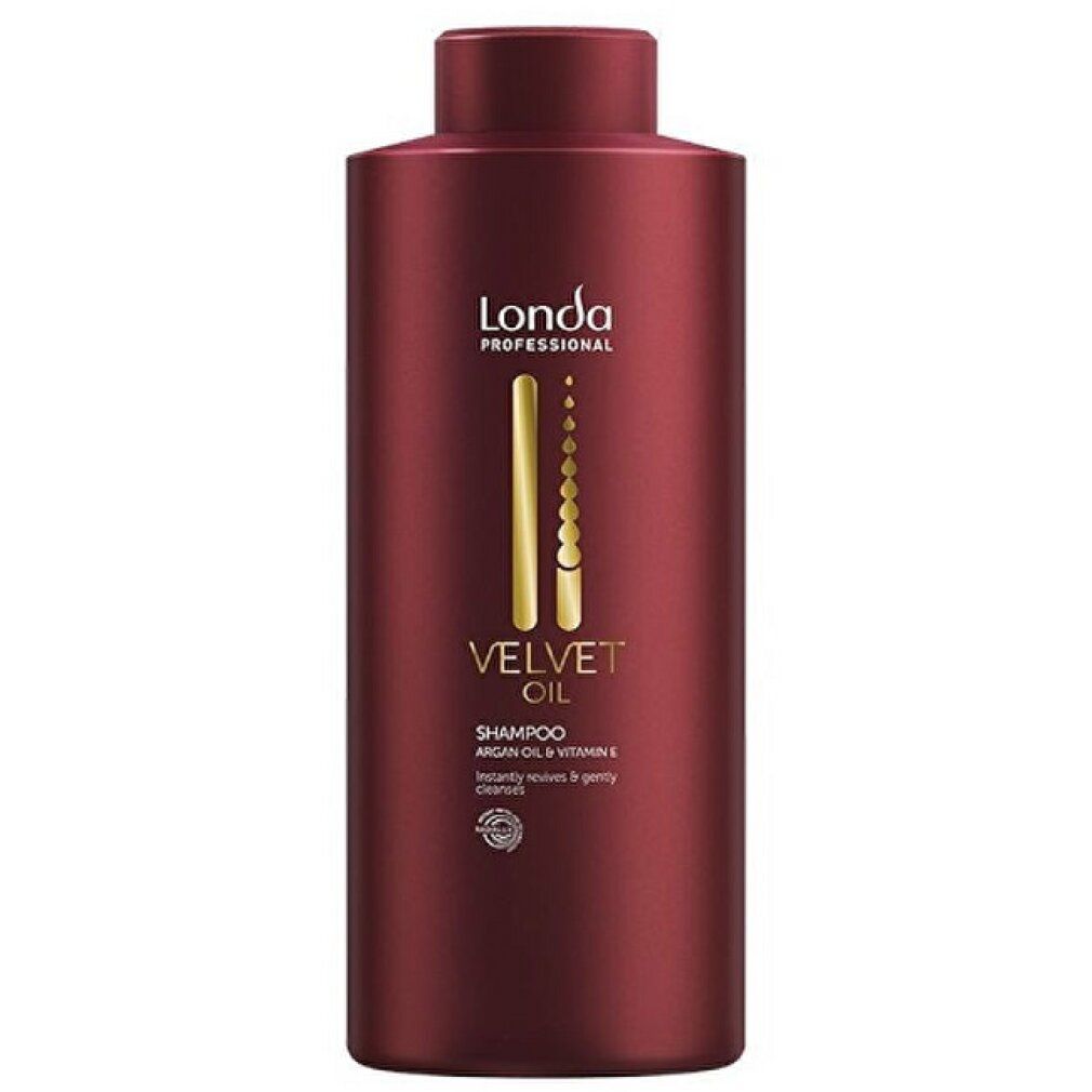 Rote Shampoo-Flasche. Goldfarbene Schrift: Velvet Oil, Shampoo. Marke: Londa Professional. Enthält Arganöl und Vitamin E. Rundes Qualitätssiegel.
