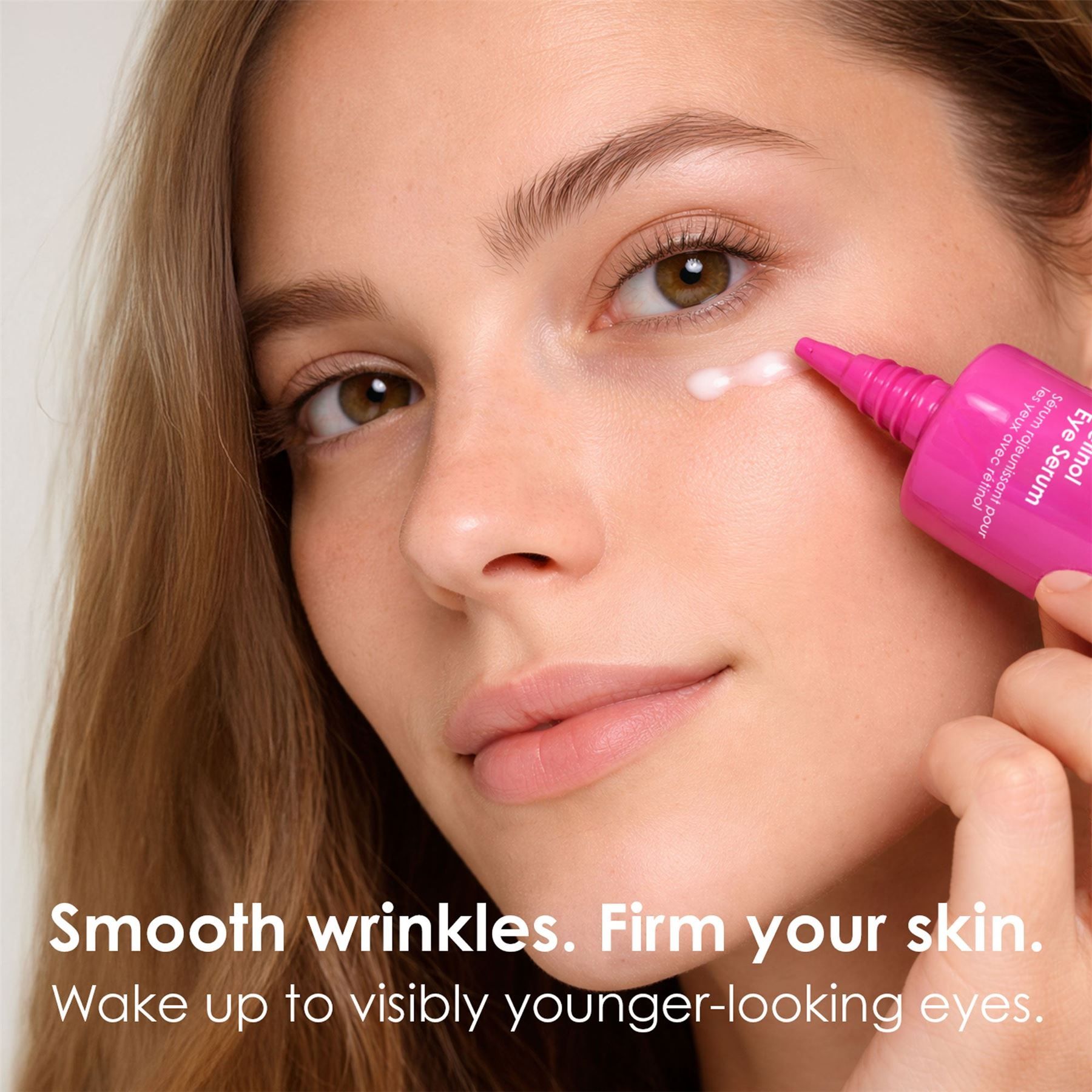 Woman applying SkinChemists Retinol Eye Serum.
