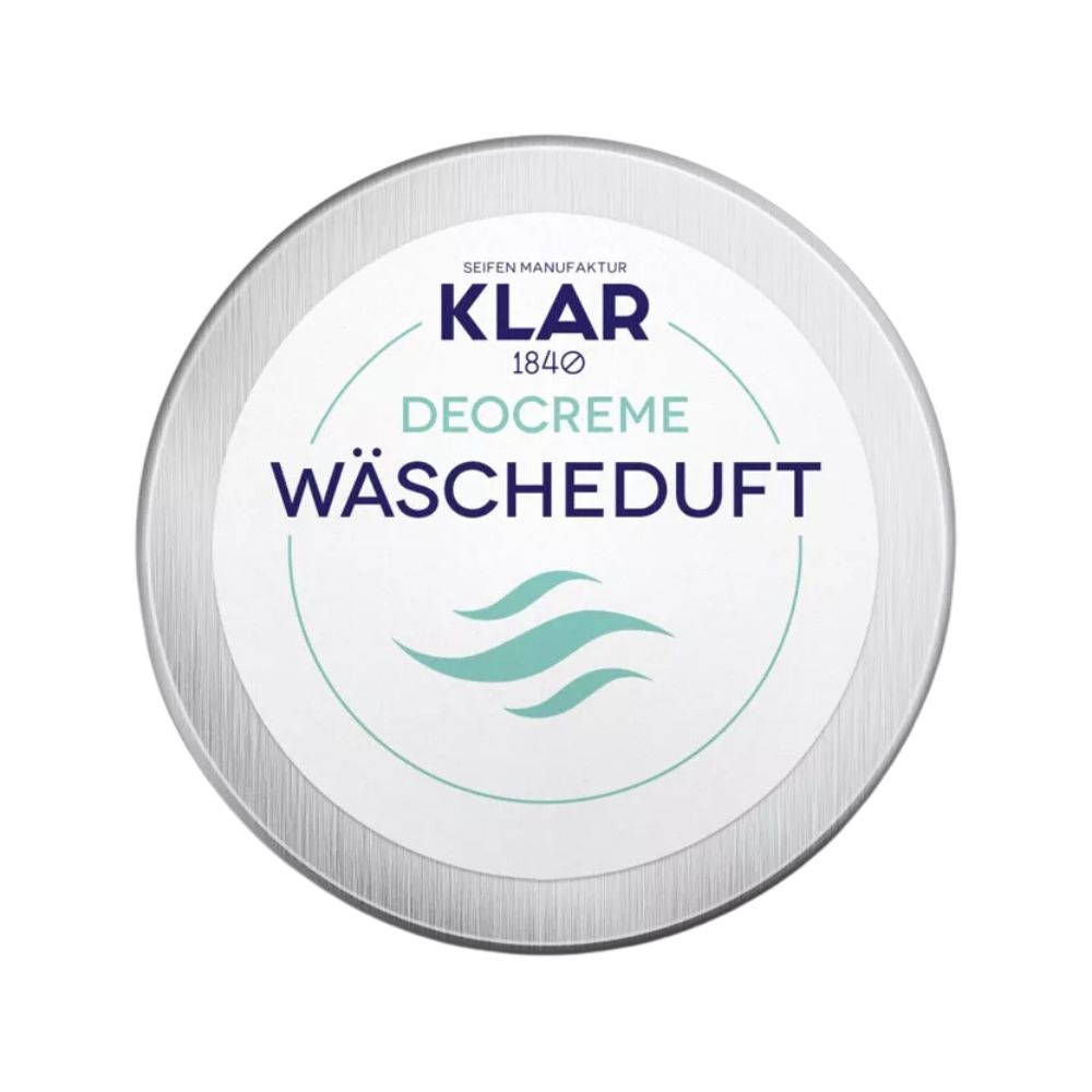 Runder Behälter mit Deckel. Aufschrift: KLAR Deocreme Wäscheduft. Türkise Wellen-Grafik.