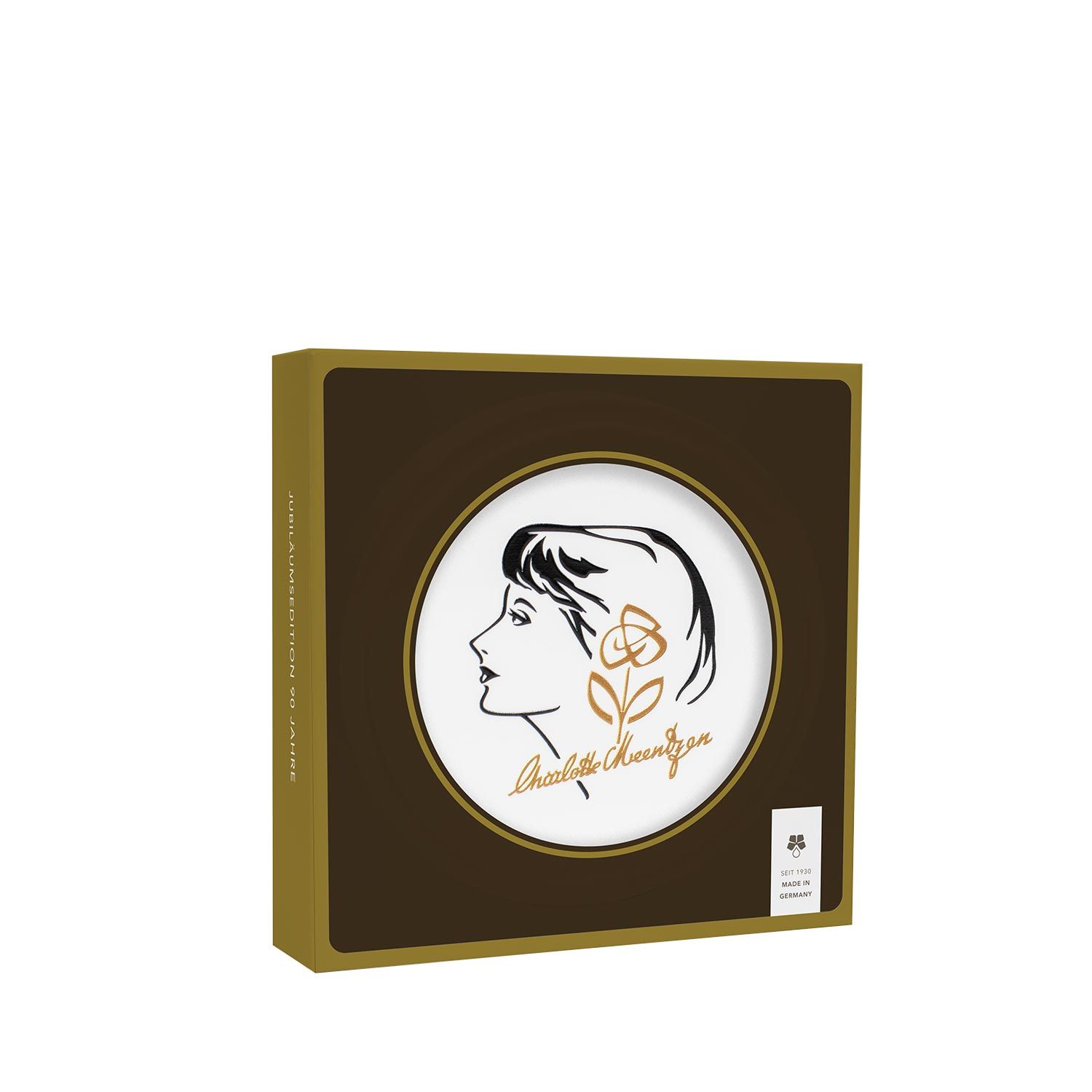 Braune Schachtel mit rundem Deckel. Auf dem Deckel: Frauenprofil, Rose und Schriftzug Charlotte Meentzen. Grün-Siegel.