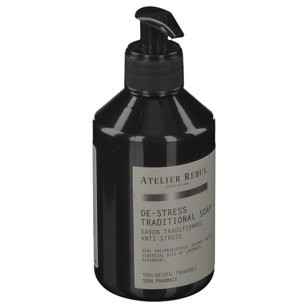 Zwarte fles met pomp. Opschrift: ATELIER REBUL, DE-STRESS TRADITIONAL SOAP. Bevat essentiële oliën.