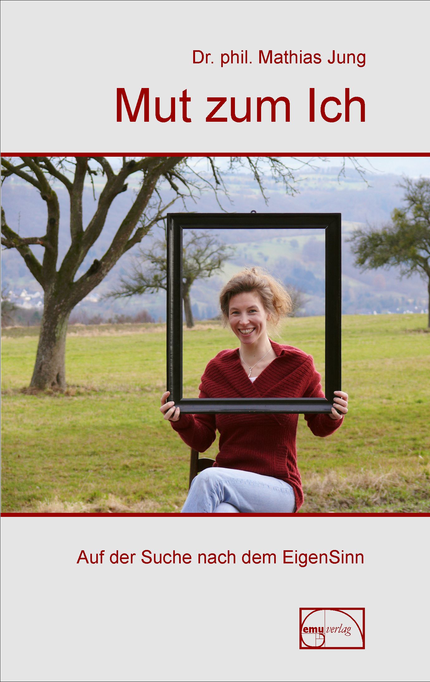Buchcover: Titel "Mut zum Ich". Frau hält Rahmen. Autor: Dr. phil. Mathias Jung. Verlag: emu Verlag.