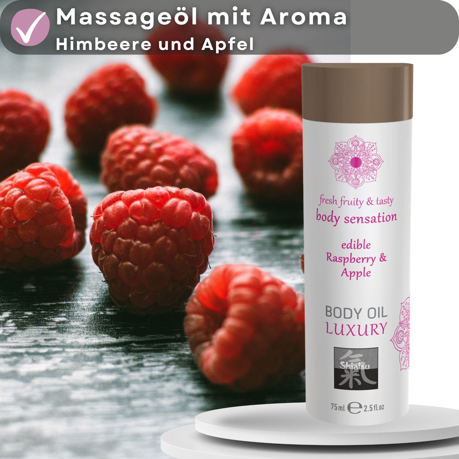 Körperöl-Flasche neben Himbeeren. Text: "Massageöl mit Aroma Himbeere und Apfel". Flasche: "fresh fruity & tasty body sensation", "edible Raspberry & Apple".