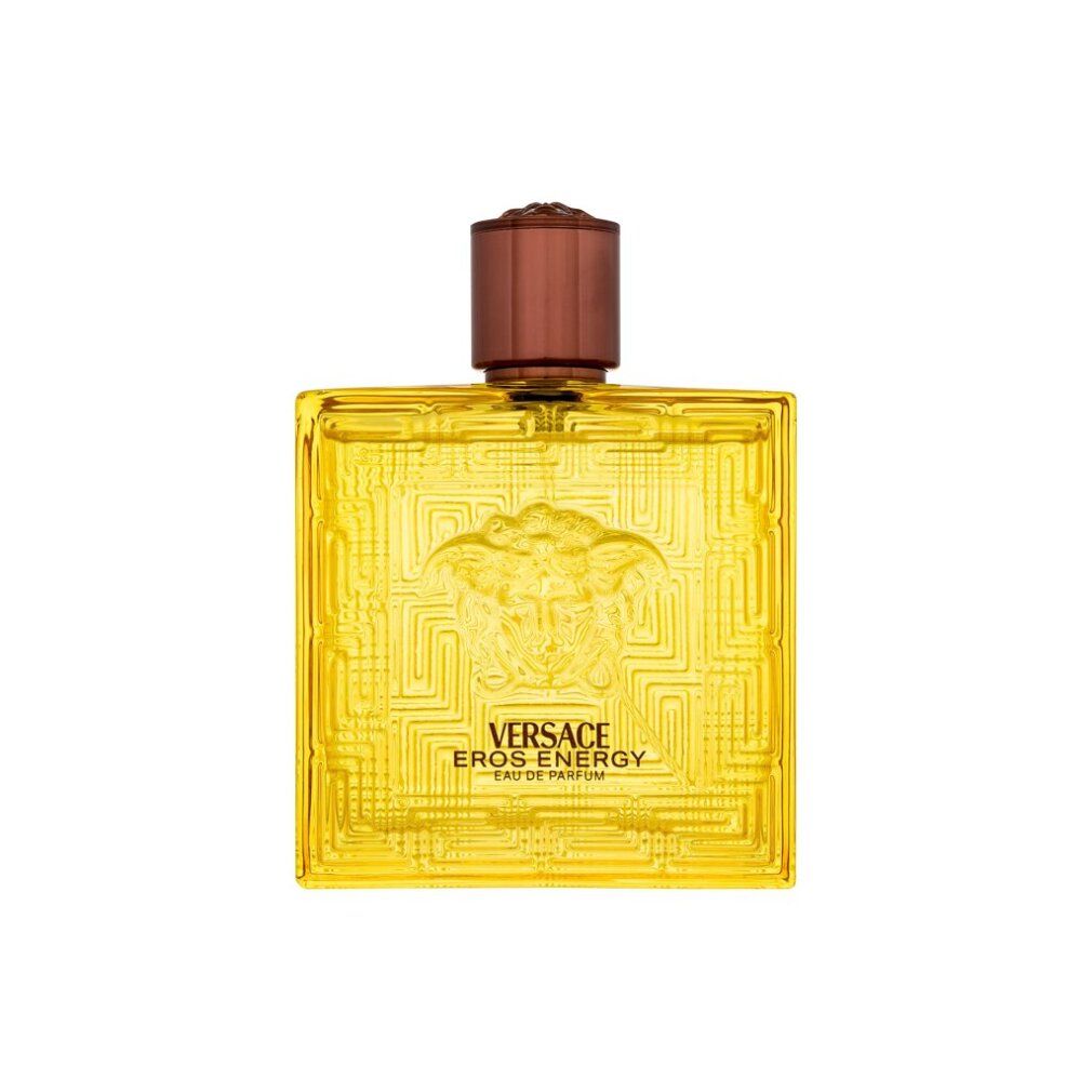 Gelbe Versace Eros Energy EdP Flasche. Quadratische Form, geprägt mit Medusa-Logo und geometrischem Muster. Brauner Verschluss.