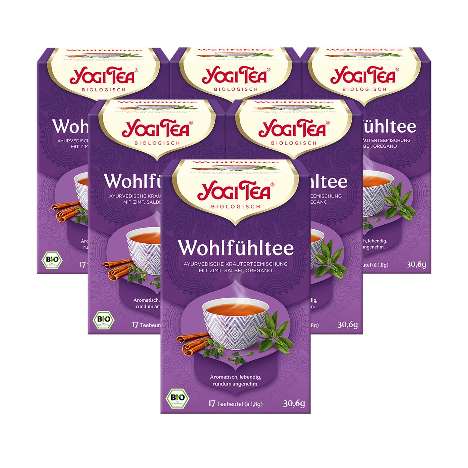 Sechs Packungen Yogi Tea Wohlfühltee Bio Kräutertee. Lila Verpackung mit Logo, Tasse, Zimtstangen und Sternanis.