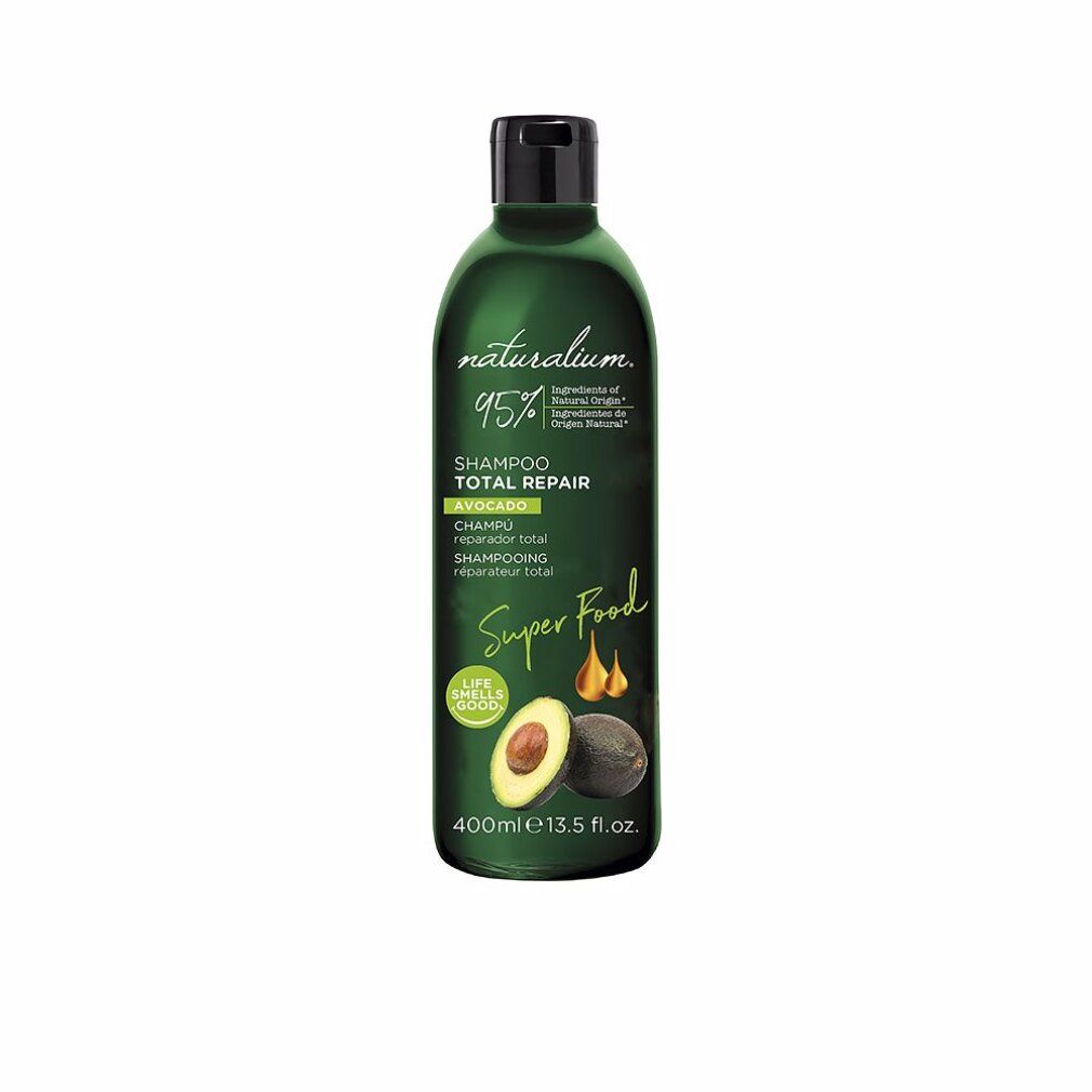 Grüne Flasche mit schwarzem Deckel. Aufschrift: Naturalium, Shampoo Total Repair Avocado. Abbildung von Avocado und Tropfen.