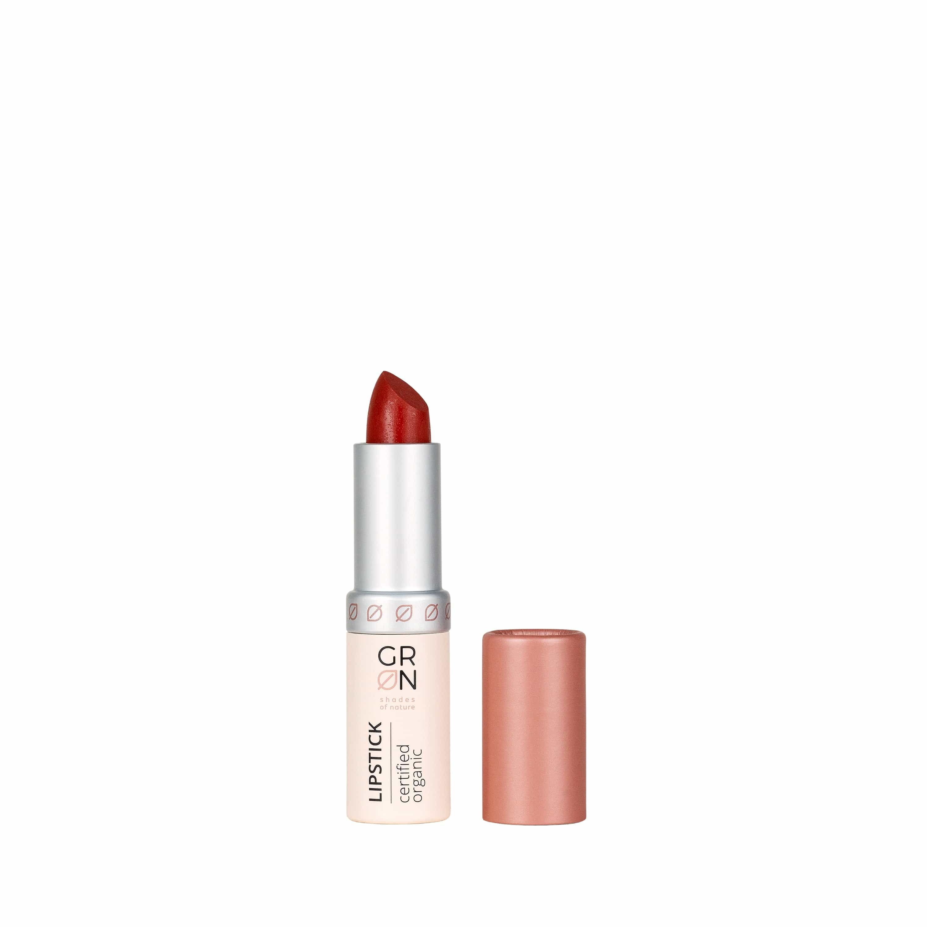 Lippenstift, geöffnet. Hülse und Kappe in Rosa. Aufschrift: GRN, Lipstick, certified organic.