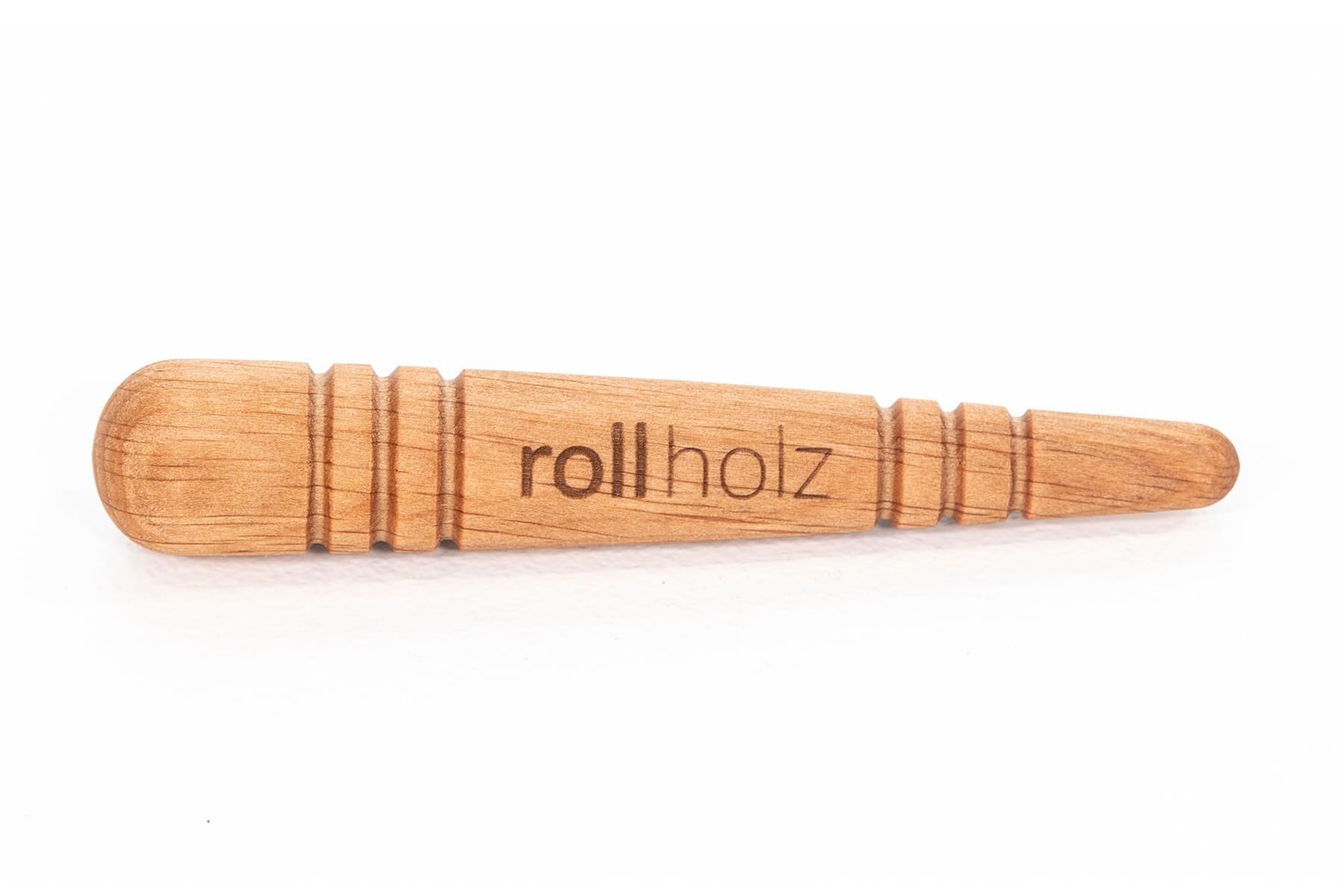 Holz-Triggerstift mit abgerundetem Griff und geriffelter Oberfläche. Der Schriftzug "rollholz" ist sichtbar.