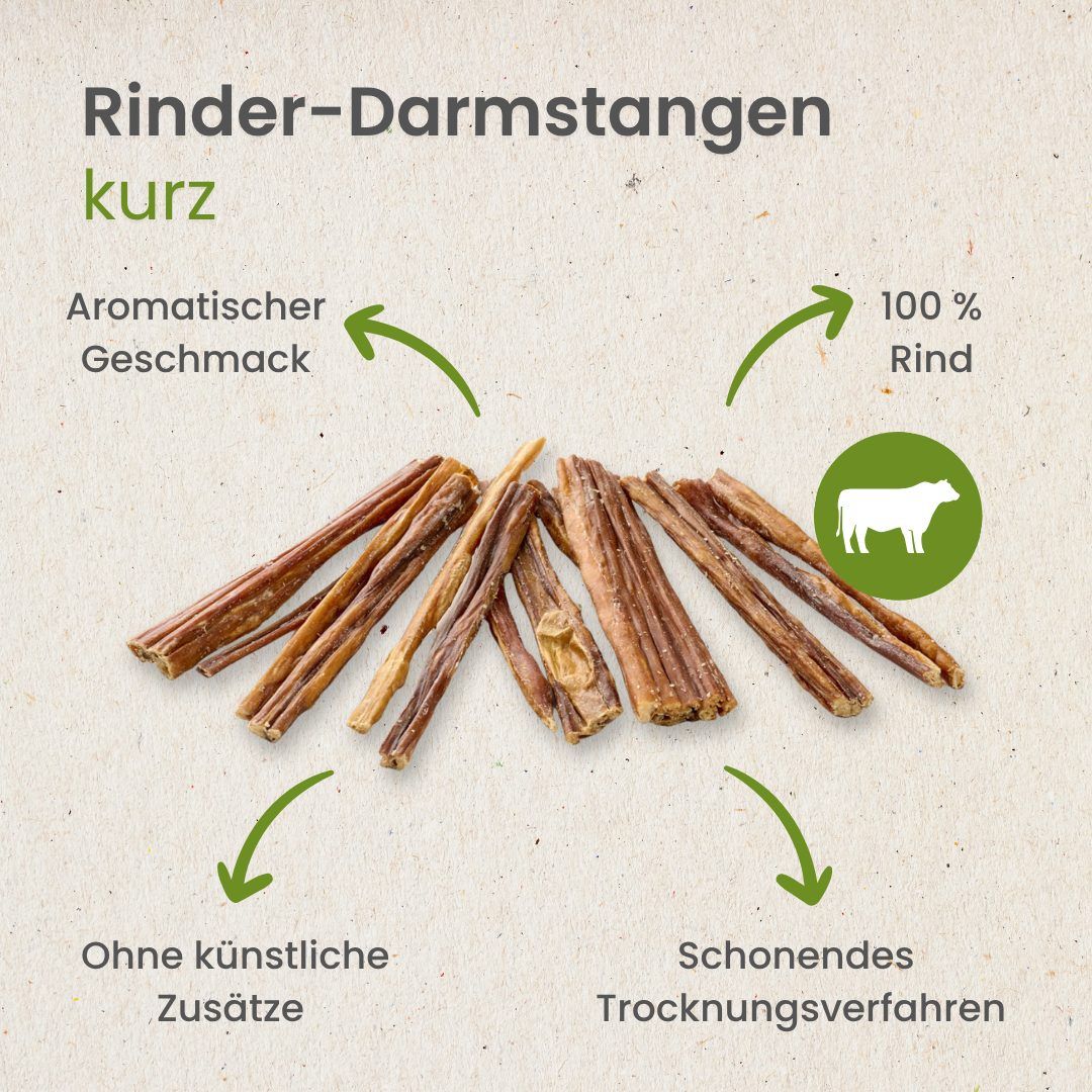 Kurze Rinder-Darmstangen mit Pfeilen, die auf "Aromatischer Geschmack", "100% Rind", "Ohne künstliche Zusätze" und "Schonendes Trocknungsverfahren" zeigen.