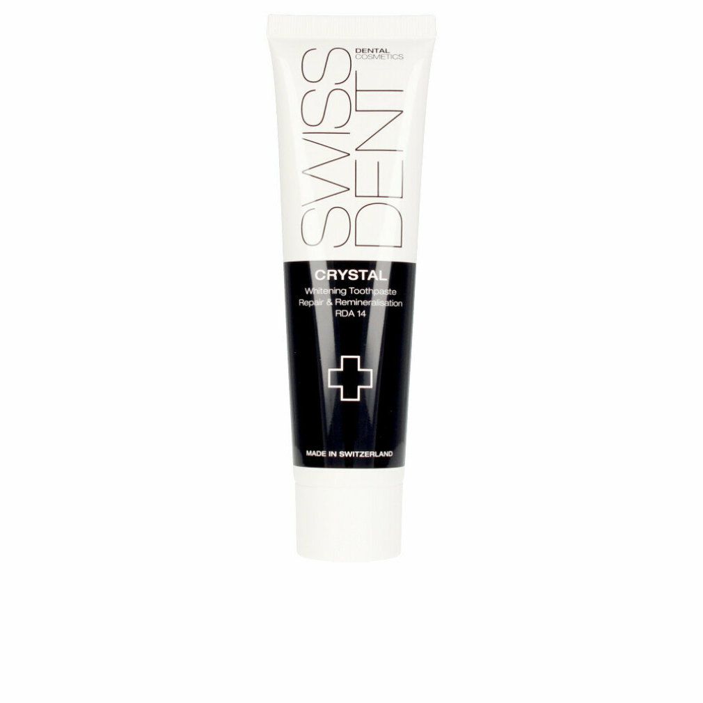 Zahncreme-Tube, weiß und schwarz. Aufschrift: SWISSDENT, CRYSTAL, Whitening Toothpaste, RDA 14. Kreuz-Symbol. Hergestellt in der Schweiz.