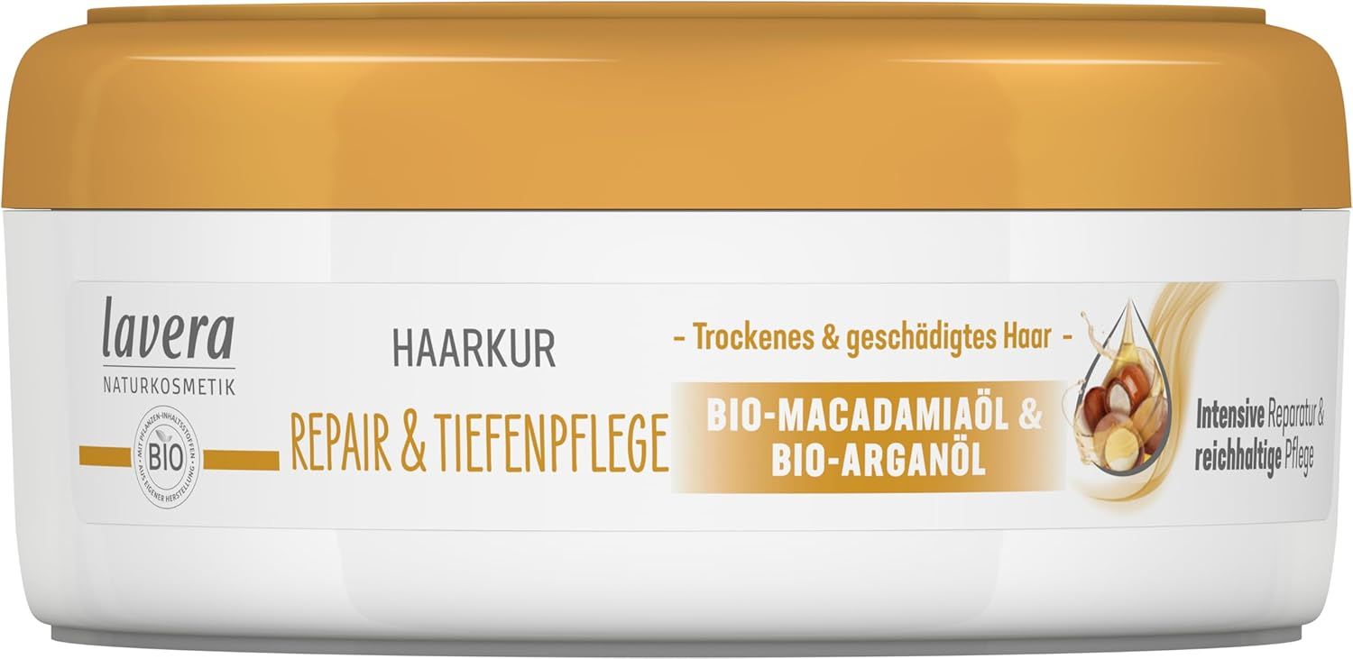 Haarkur-Tube mit goldfarbenem Deckel. Text: Haarkur Repair & Tiefenpflege, Bio-Macadamiaöl & Bio-Arganöl. Für trockenes & geschädigtes Haar.