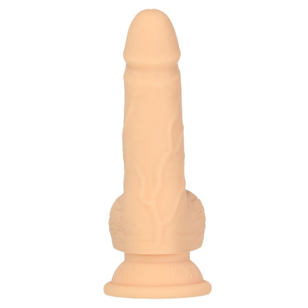Beigefarbener Dildo mit geriffelter Oberfläche und abgerundeter Spitze. Mit Sockel.