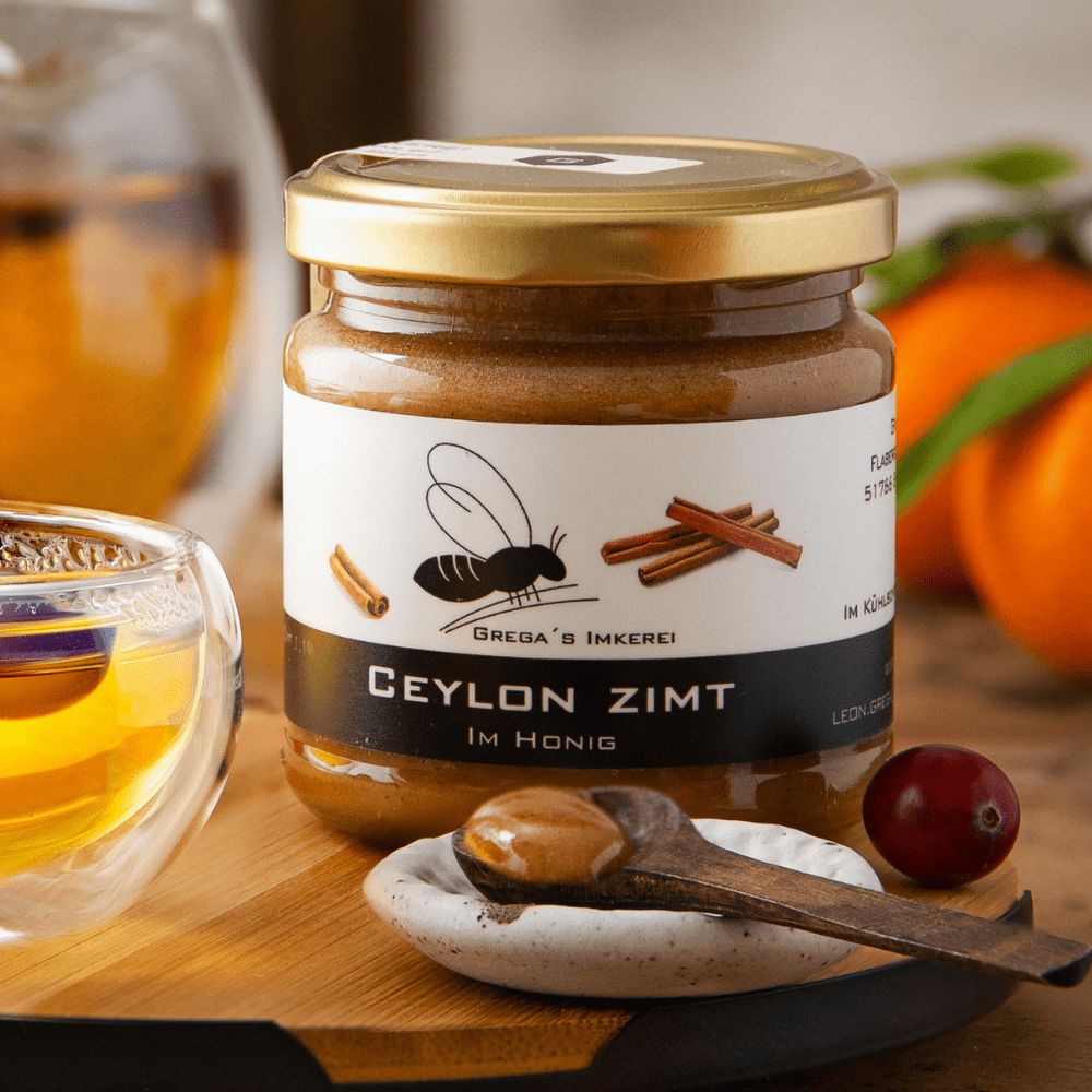 250g Dose Orange im Honig mit Nährwertangaben und Bienenmotiv.