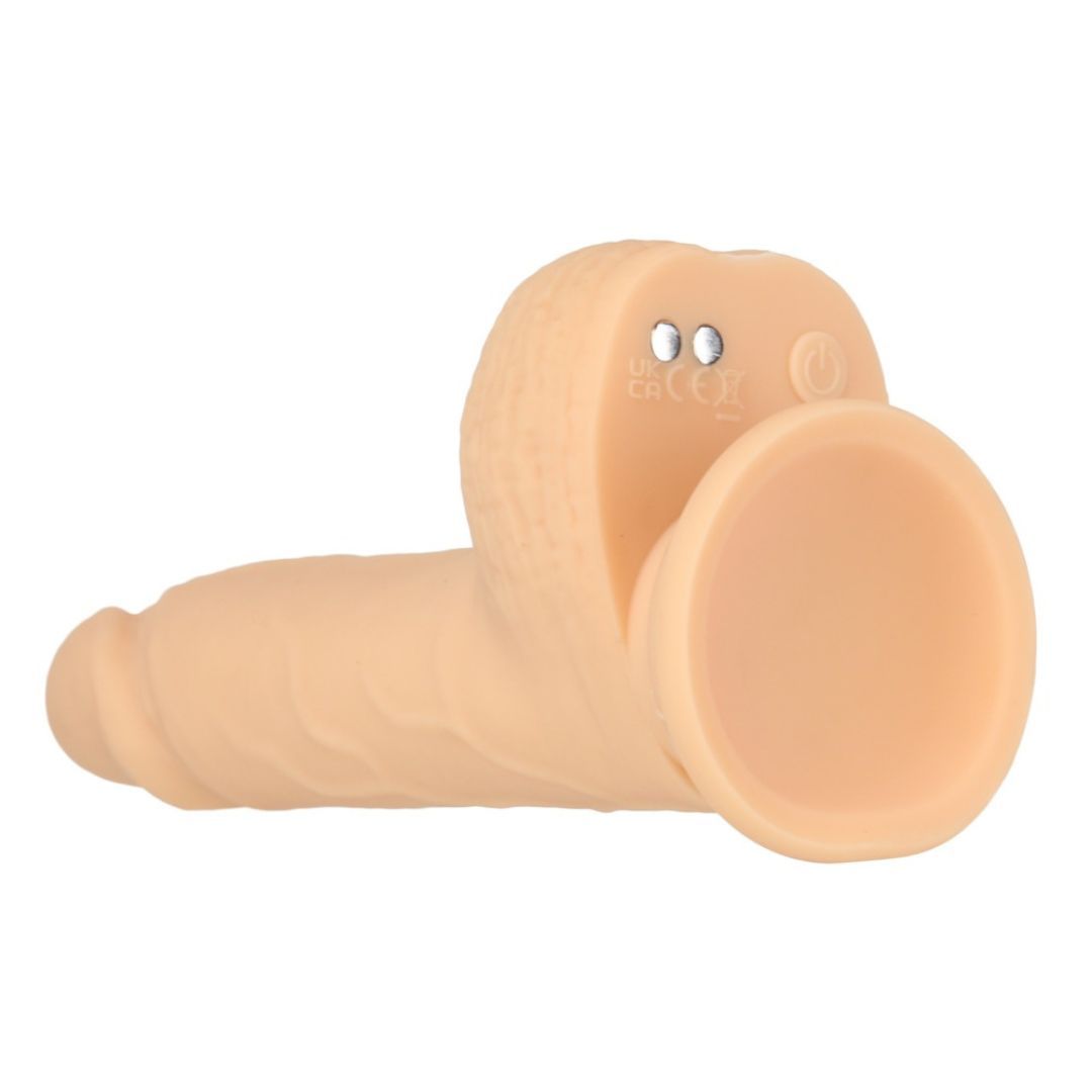 Beigefarbener Dildo mit Saugnapf. Zwei Knöpfe am Sockel.