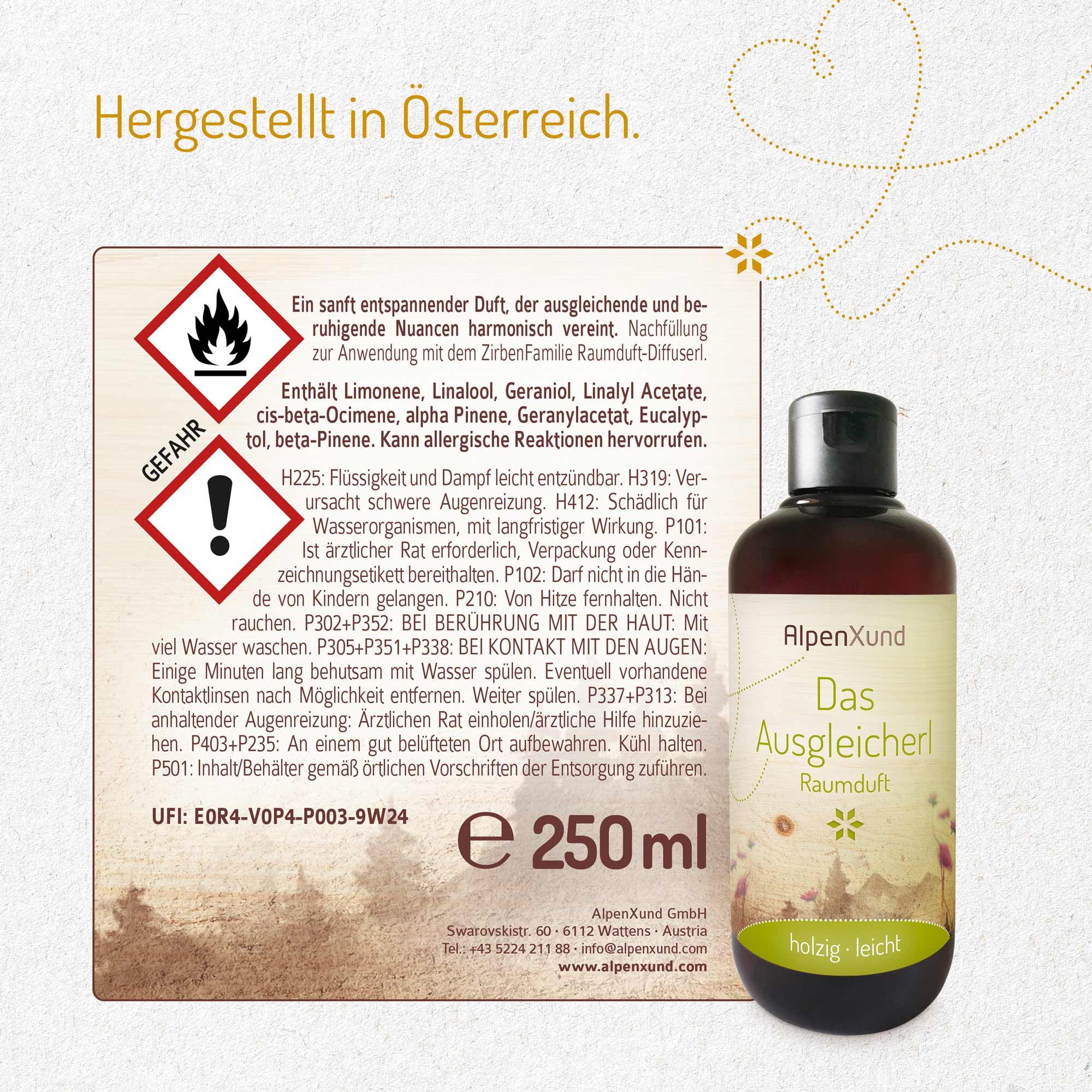 Braune Flasche mit schwarzem Deckel und Etikett. Aufschrift: AlpenXund, Das Ausgleicherl, Raumduft. Holzige, leichte Duftnote. Daneben: Warnhinweise.