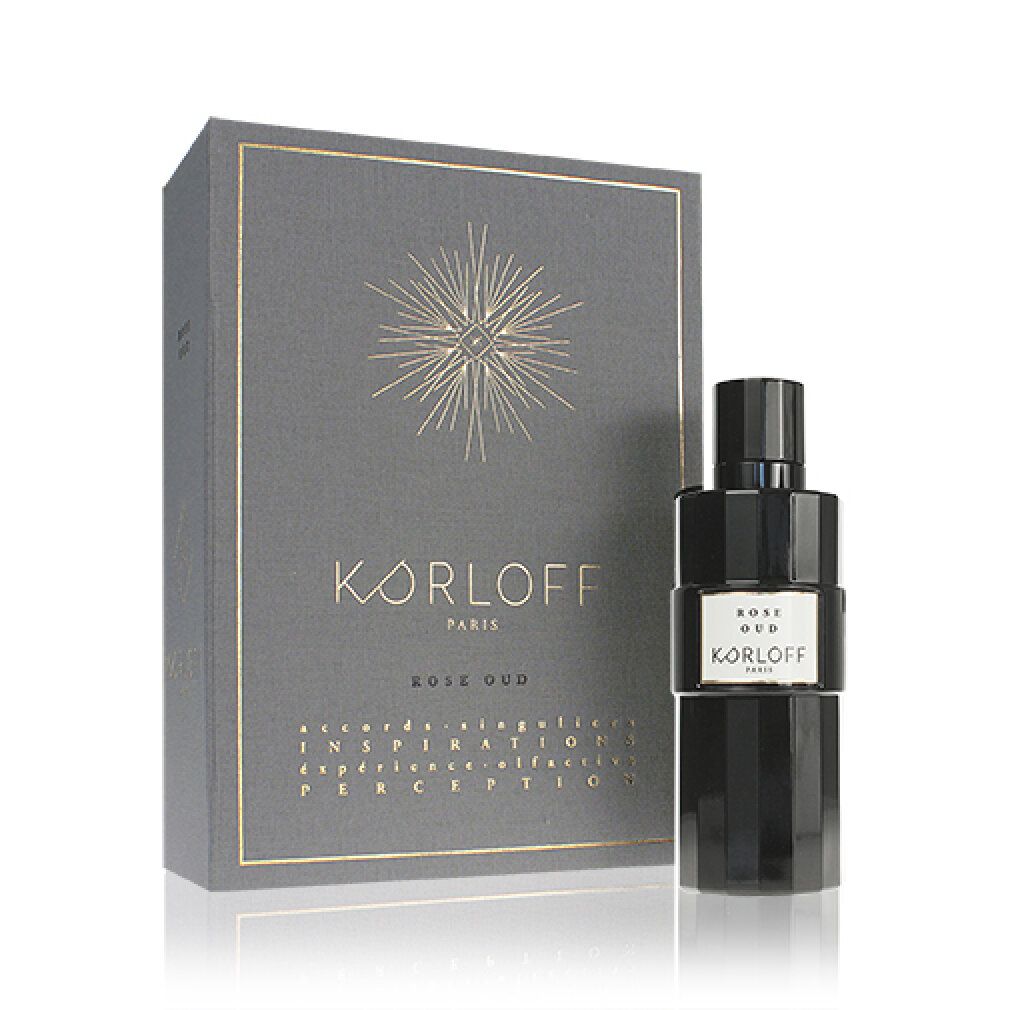 Graue Schachtel und schwarze Flasche. Aufschrift: KORLOFF, Rose Oud. Flasche mit weißem Etikett.