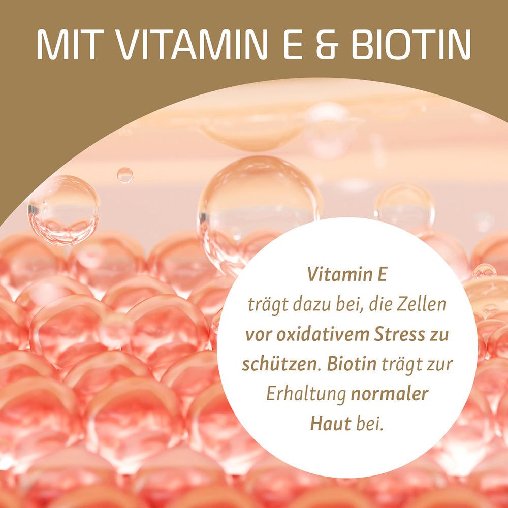 Nahaufnahme von Bläschen mit Text über Vitamin E und Biotin.