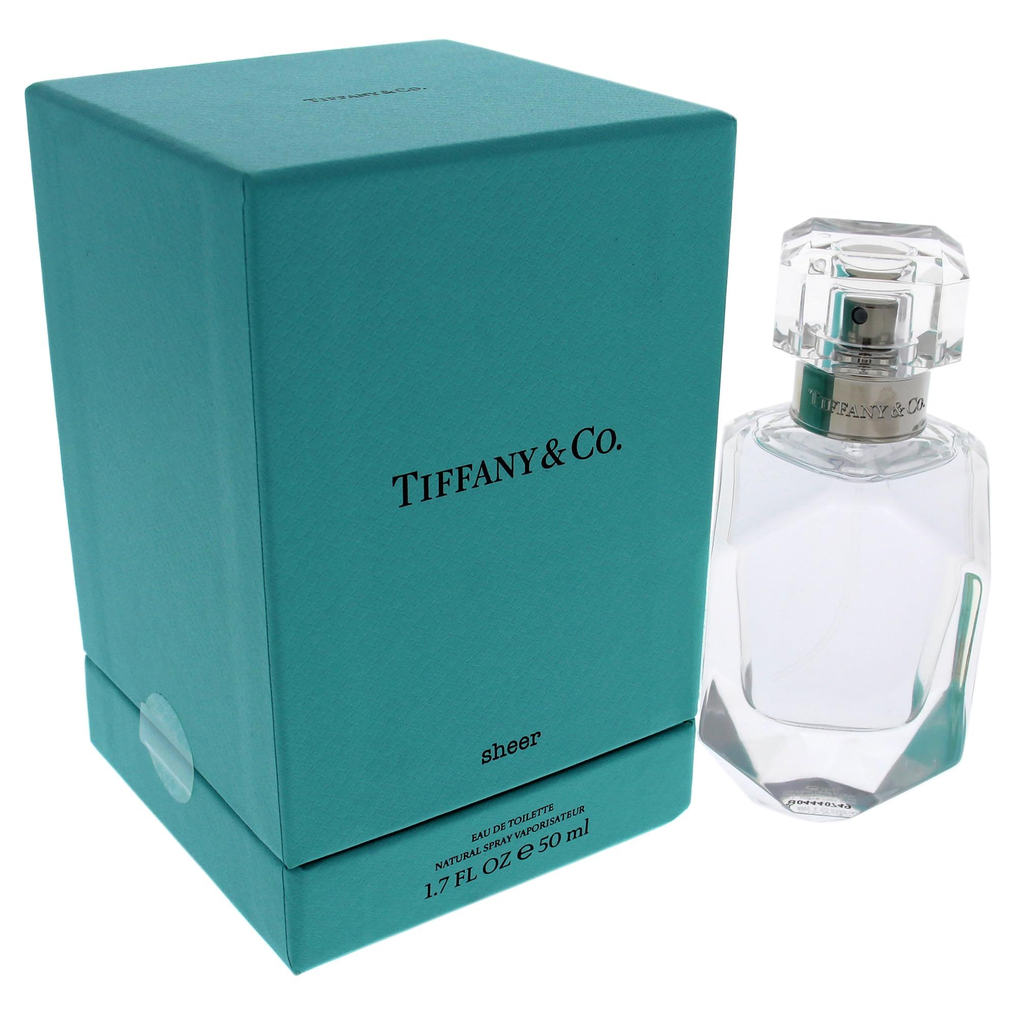 Türkisfarbene Schachtel und transparente Parfumflasche. Auf der Schachtel steht "Tiffany & Co.". Auf der Flasche steht "Sheer".