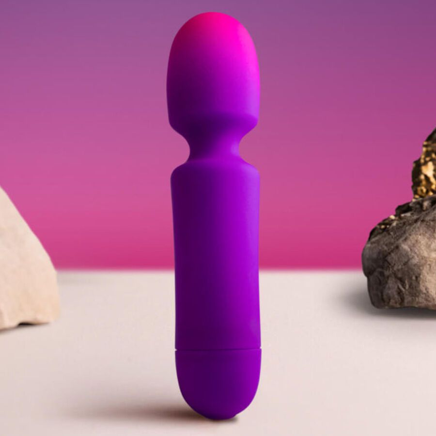 Lila Vibrator mit Farbverlauf von Lila zu Pink. Auf einer Oberfläche platziert.