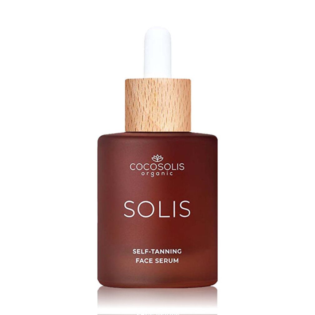 Braune Glasflasche mit Pipette, Holzdeckel. Beschriftung: COCOSOLIS ORGANIC SOLIS SELF-TANNING FACE SERUM.