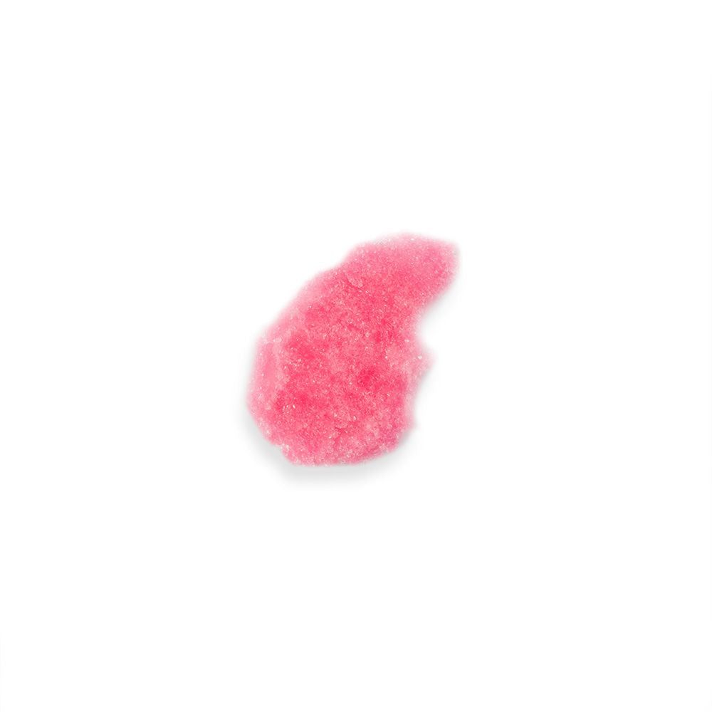 Rosa Badesalz-Klumpen auf weißem Hintergrund. Grobkörnige Textur.