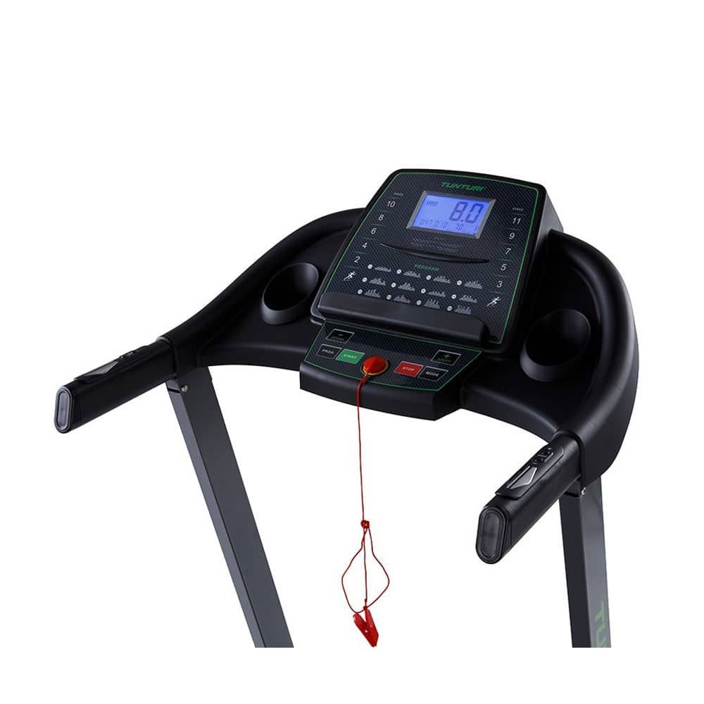 Laufbandkonsole mit digitaler Anzeige. Roter Not-Aus-Knopf. Schwarze Griffe. Tunturi-Logo. Rotes Sicherheitsband.