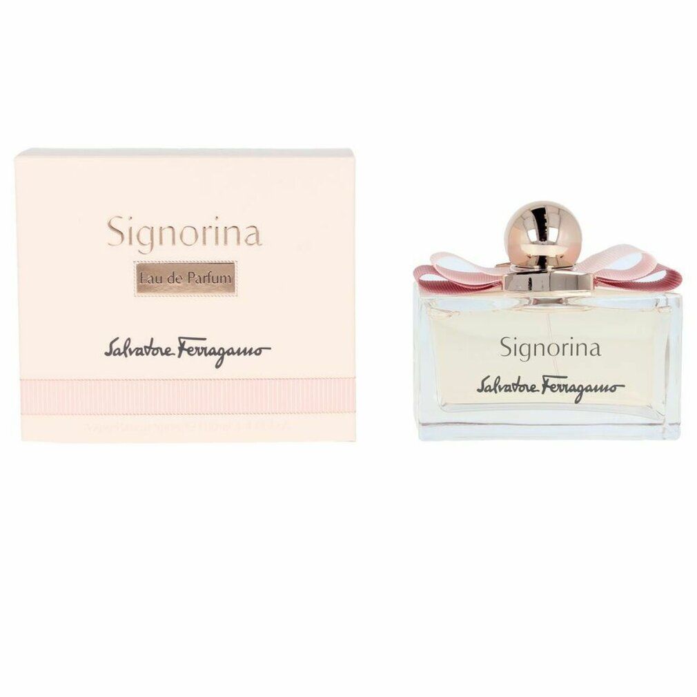 Signorina Eau de Parfum Spray und Verpackung. Rechteckiger Flakon, rosa Flüssigkeit, rosafarbene Schleife, kupferfarbener Verschluss.