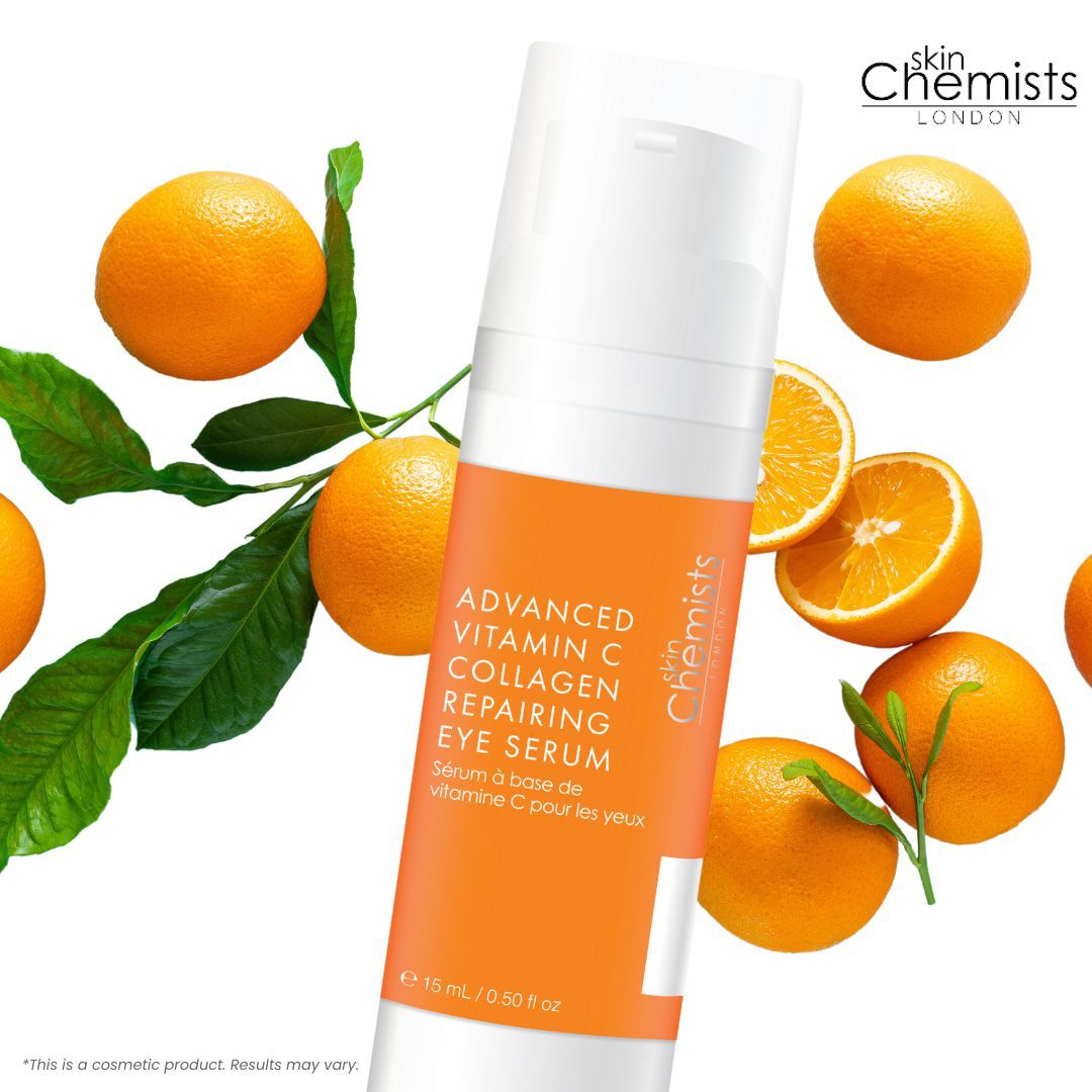 Eine Flasche mit orangefarbenem Etikett neben Orangen. Auf dem Etikett steht "Advanced Vitamin C Collagen Repairing Eye Serum".
