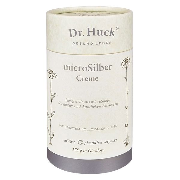 Zylindrische Verpackung mit Aufschrift Dr. Huck microSilber Creme. Mit floralen Illustrationen und silbernem Deckel.