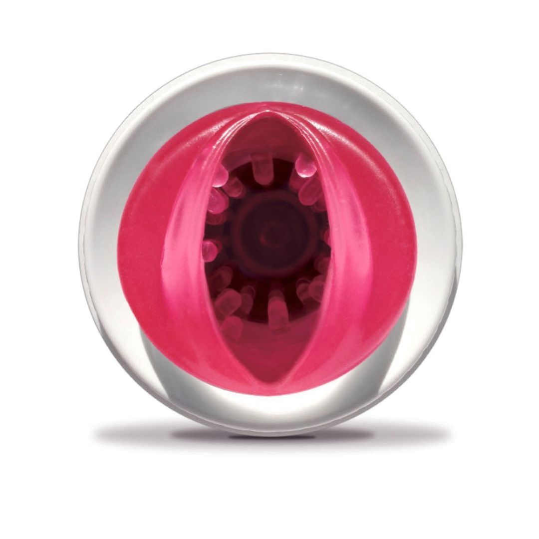 Rundes Gerät mit rosa Innenleben. Sichtbare Öffnungen und Strukturen.