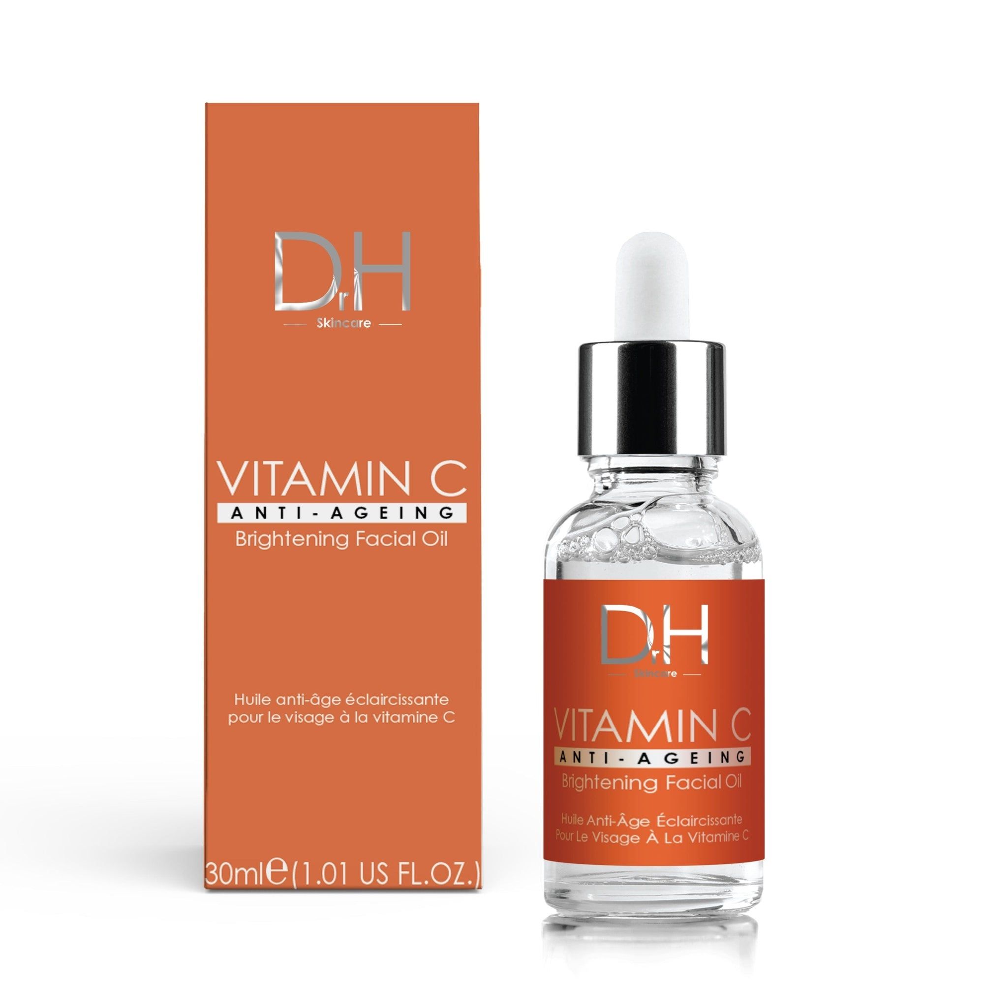 Eine Flasche und eine Schachtel. Aufschrift: D.H. Vitamin C Anti-Aging Brightening Facial Oil. Flasche mit Pipette.