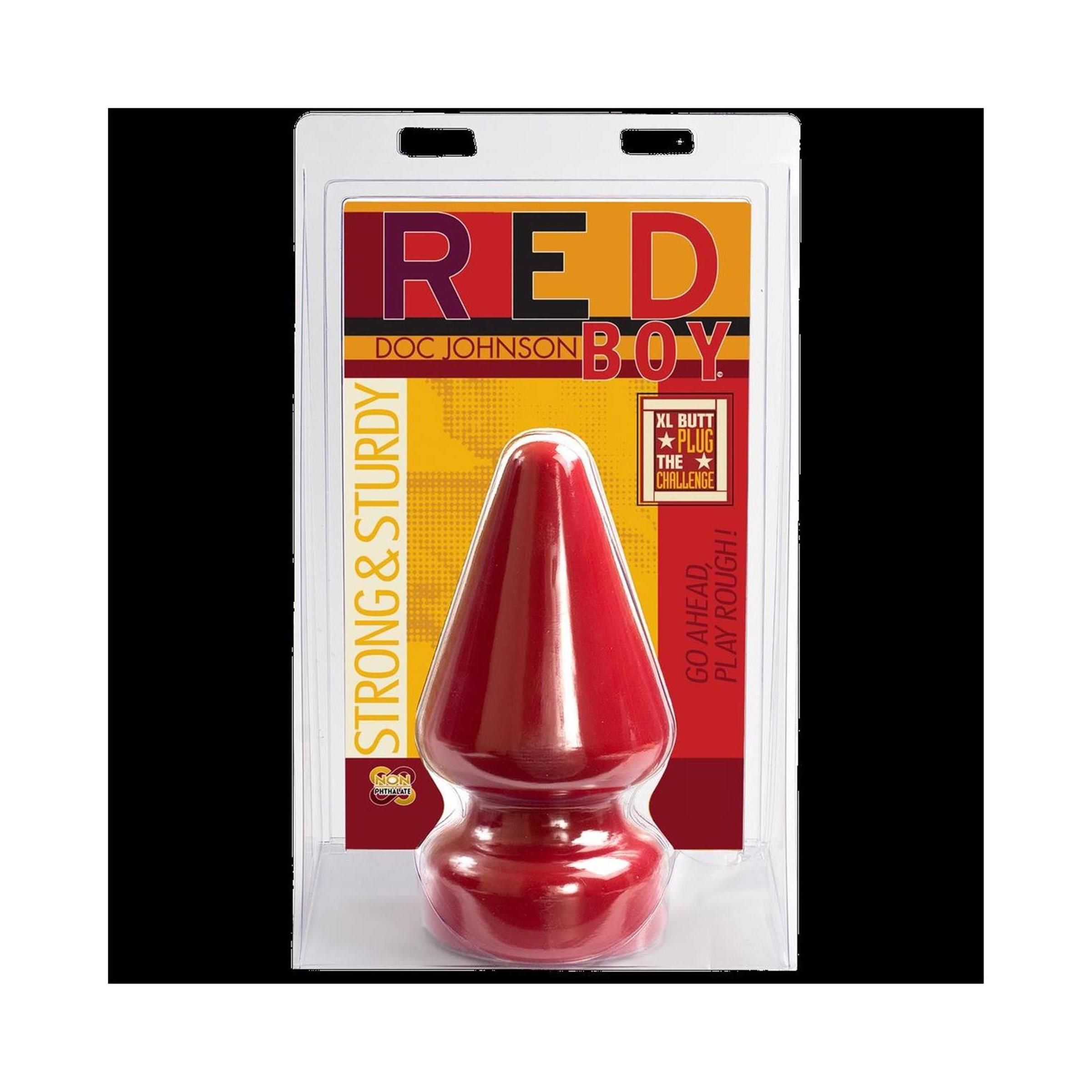 Roter Butt Plug in Blisterverpackung. Aufschrift "RED BOY" und "DOC JOHNSON". "STRONG & STURDY".