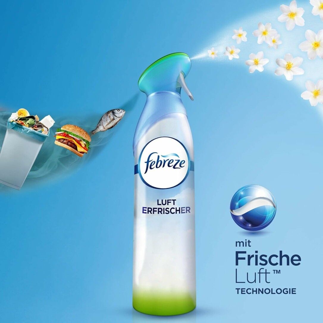 Blau-weißes Spray mit "Febreze Luft Erfrischer"-Logo. Sprüht weiße Blüten. Text: "mit Frische Luft Technologie".