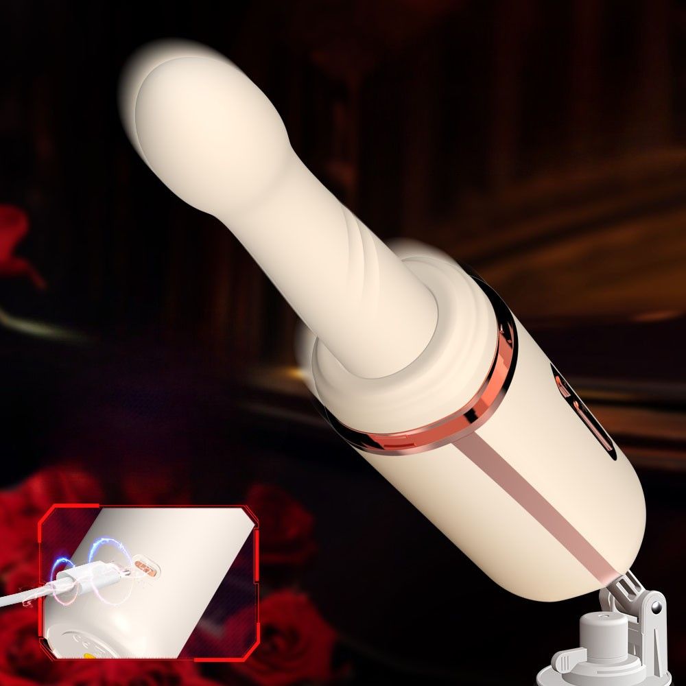 Beigefarbener Vibrator mit goldfarbenen Akzenten, mit Ladeanschluss und Saugnapf.