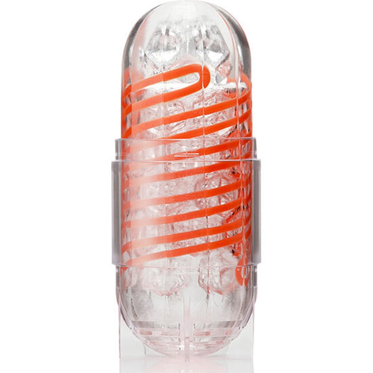 Transparenter, länglicher Gegenstand mit orangefarbenen Streifen. In einer transparenten Halterung.