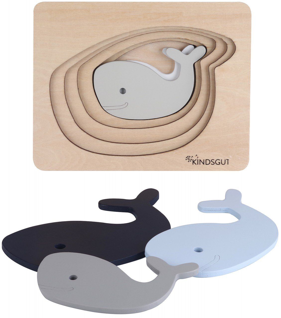 Kindsgut Wal-Puzzle mit Wal-Puzzleteilen. Mehrere Wal-Puzzleteile liegen neben dem Puzzle. Holz, blau und grau.