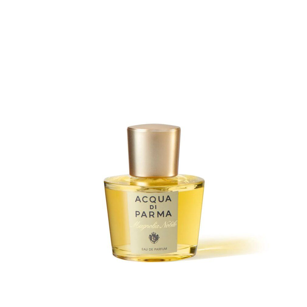 Parfümflakon aus Glas mit goldfarbenem Verschluss. Aufschrift: Acqua di Parma Magnolia Nobile, Eau de Parfum.