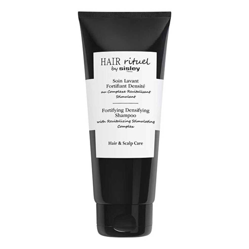 Schwarze Tube mit weißem Etikett. Text: Hair Rituel by Sisley, Fortifying Densifying Shampoo.