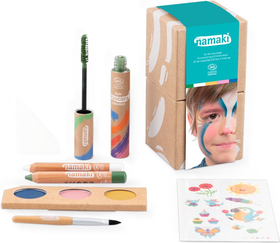 Geschenkbox mit Kosmetikprodukten. Enthält Mascara, Stifte, Lidschatten und Pinsel. Verpackung mit Kind mit Gesichtsbemalung.