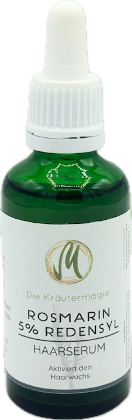 Grüne Glasflasche mit weißem Etikett. Aufschrift: "Die Kräutermagie", "Rosmarin 5% Redensyl Haarserum". Mit Pipette.